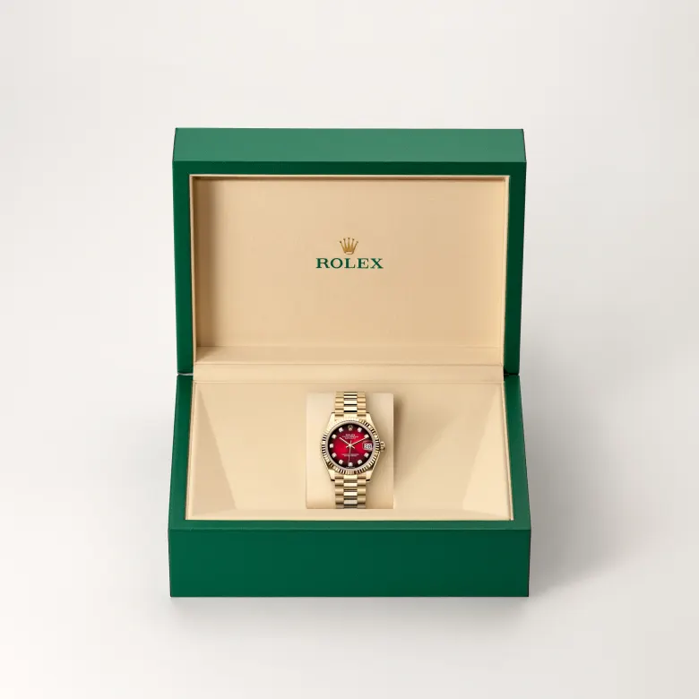 Rolex Datejust 31 in yellow gold with a Red ombré dial set with diamonds, fluted bezel, and President bracelet - AH Riise