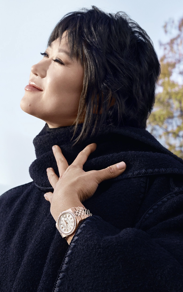 Rolex Testimonee Yuja Wang wearing a Land-Dweller watch in a city setting - AH Riise Rolex Boutique St. Thomas Rolex Testimonee Yuja Wang wearing a Land-Dweller watch in a city setting - AH Riise Rolex Boutique St. Thomas