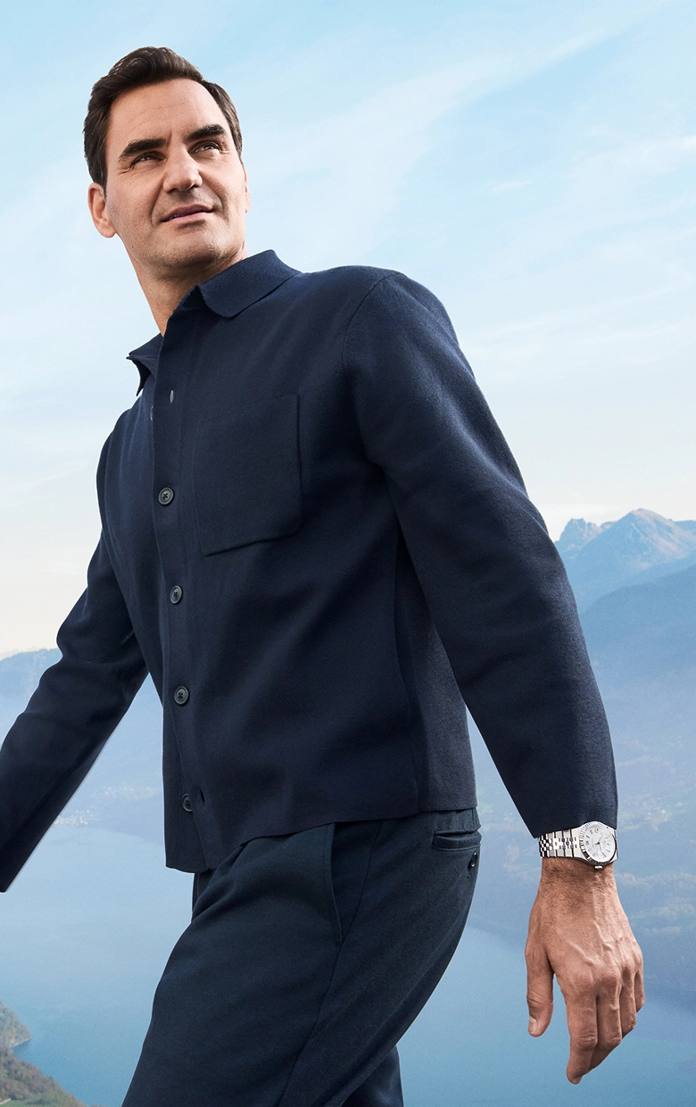 Rolex Testimonee Roger Federer wearing a Land-Dweller watch in a mountainous outdoor setting - AH Riise Rolex Boutique St. Thomas Rolex Testimonee Roger Federer wearing a Land-Dweller watch in a mountainous outdoor setting - AH Riise Rolex Boutique St. Thomas
